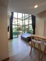 Modern living room with large windows and natural light