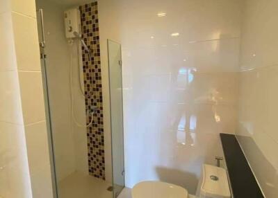 Modern bathroom with shower, toilet, and basin