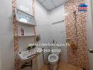 Bathroom with shower, toilet, sink, and tiled walls