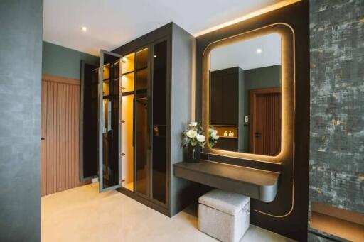 Modern bedroom with built-in wardrobe and vanity area