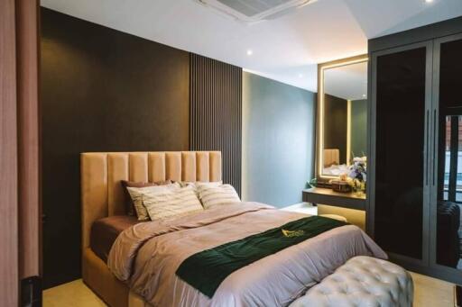 Modern bedroom with large bed and built-in wardrobe