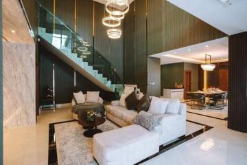 Spacious and modern living room with stairway and dining area