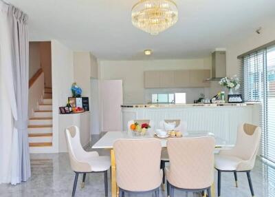 Modern dining area adjacent to kitchen