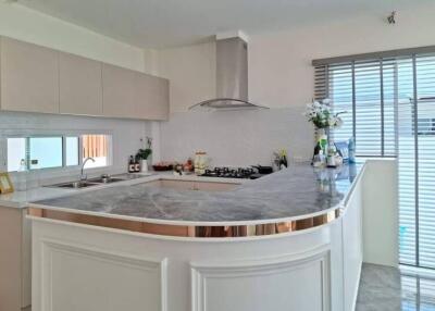 Modern kitchen with a marble countertop and stylish cabinetry