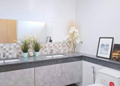 Modern bathroom with double sink vanity and decor