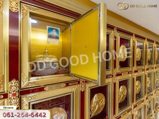 Columbarium with urn niches and golden framed compartments