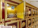 Columbarium with urn niches and golden framed compartments