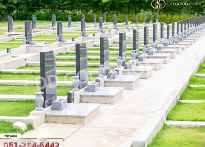 A serene cemetery with well-maintained graves and lush green surroundings