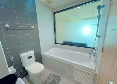 Modern bathroom with bathtub and large window