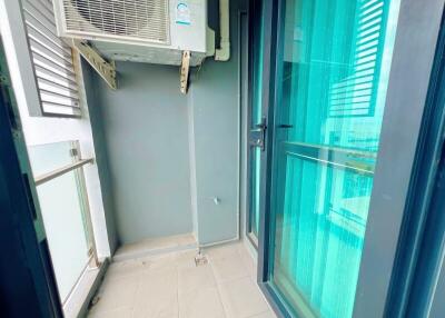Modern balcony with glass doors and air conditioning unit
