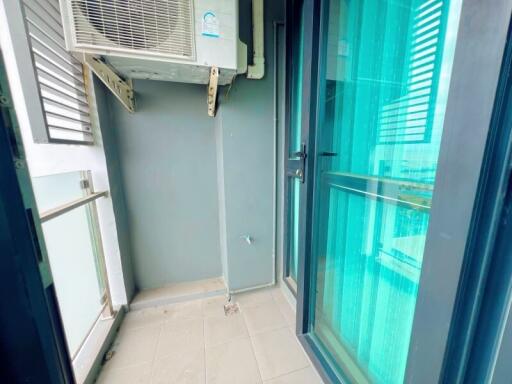 Modern balcony with glass doors and air conditioning unit