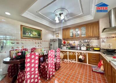 Traditional kitchen with wooden cabinets and tiled floor