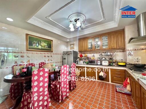 Traditional kitchen with wooden cabinets and tiled floor