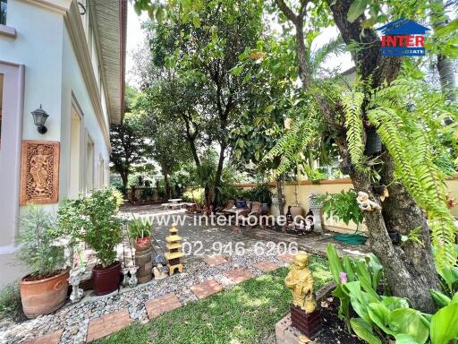 Beautifully landscaped garden with plants and stone pathways