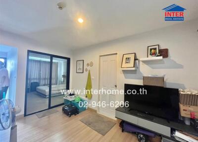 Modern bedroom with sliding glass door and TV unit