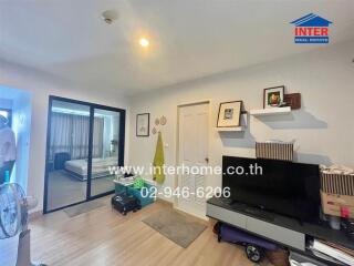 Modern bedroom with sliding glass door and TV unit