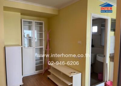 Small living area with adjacent bathroom