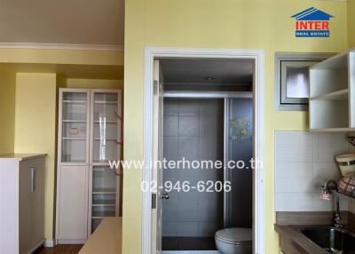 Modern kitchen area with adjacent bathroom