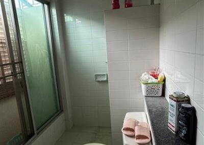 Bathroom with shower area and toilet