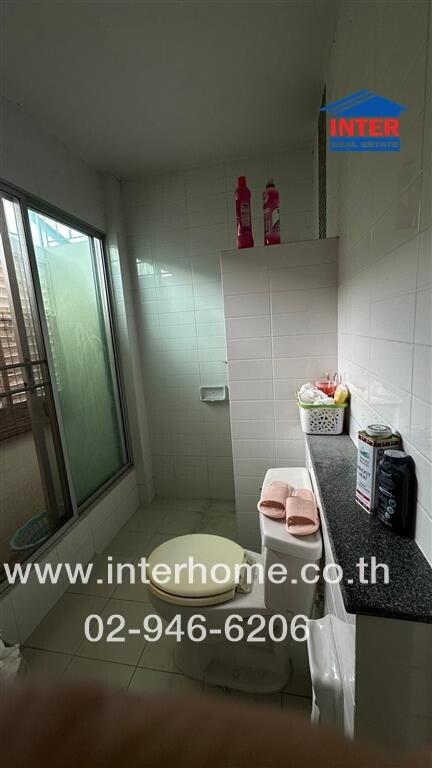 Bathroom with shower area and toilet