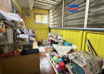 Small enclosed storage area with various household items