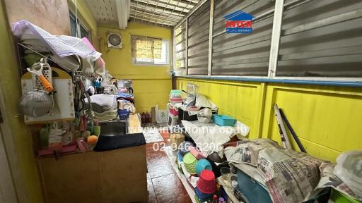 Small enclosed storage area with various household items