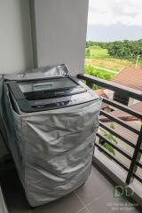 Balcony with a washing machine