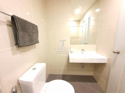 Modern bathroom with wall-mounted sink and toilet