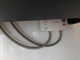 Water heater with metal pipes