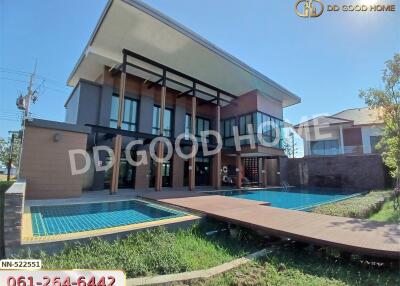 Modern two-story house with pool and garden