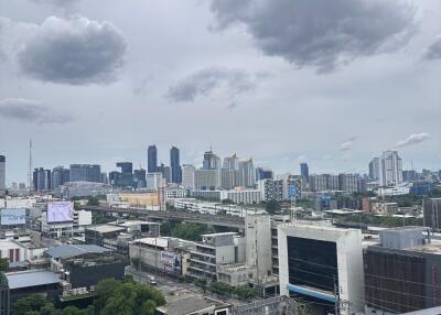 City skyline view with buildings and cloudy sky