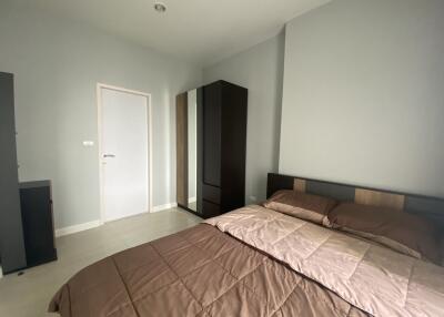 Modern bedroom with double bed and wardrobe