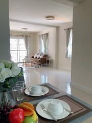 Spacious and well-lit living room with a dining area