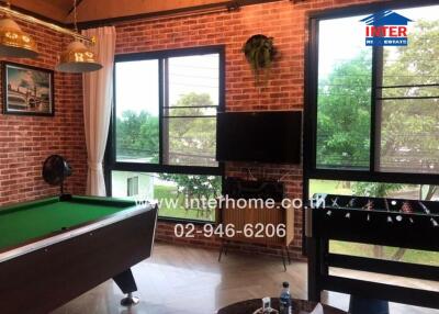 Recreation room with pool table and foosball table