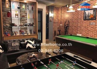 Recreation room with pool table, foosball table, and display shelves