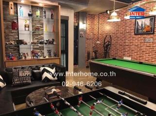 Recreation room with pool table, foosball table, and display shelves