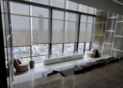 Modern building interior with large windows overlooking cityscape