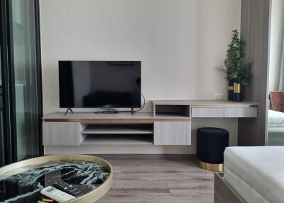 Modern living room with TV and minimalist decor