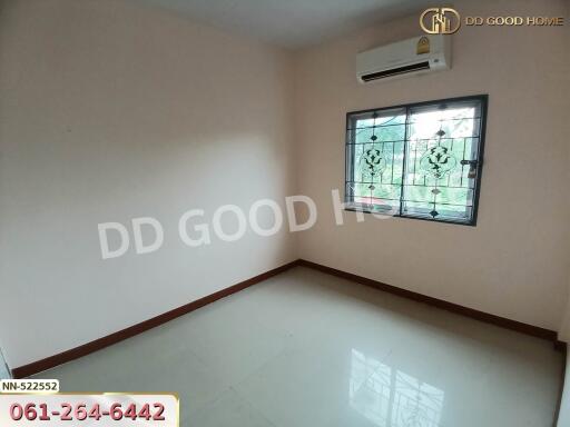 Empty bedroom with tiled floor and window