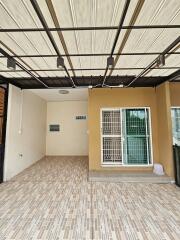 Outdoor space with covered patio and tiled flooring