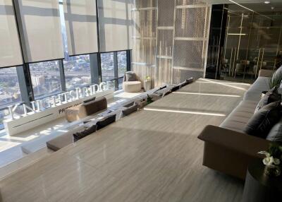 Modern living area with floor-to-ceiling windows and city view