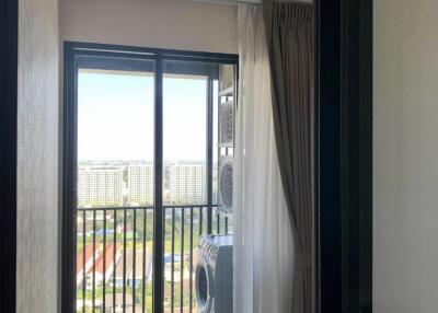 Laundry area with city view and balcony