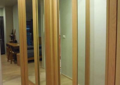 Spacious hallway with mirrored sliding closets