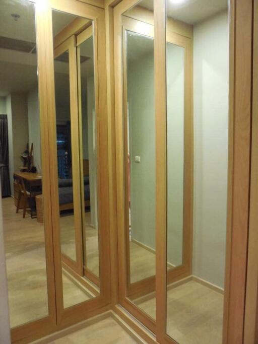 Spacious hallway with mirrored sliding closets