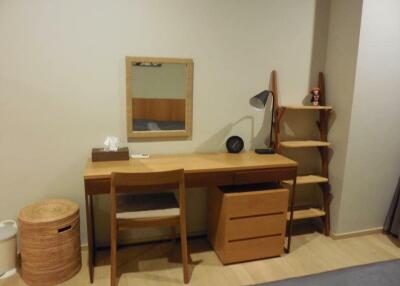 Bedroom with a study desk and shelves