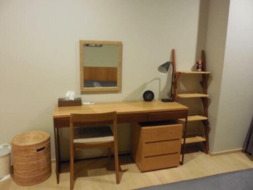 Bedroom with a study desk and shelves