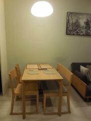 Dining area with wooden table and chairs