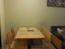 Dining area with wooden table and chairs