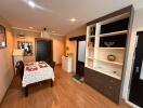 Modern dining room with wooden flooring and built-in shelves