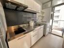 Modern kitchen with stainless steel appliances and ample storage